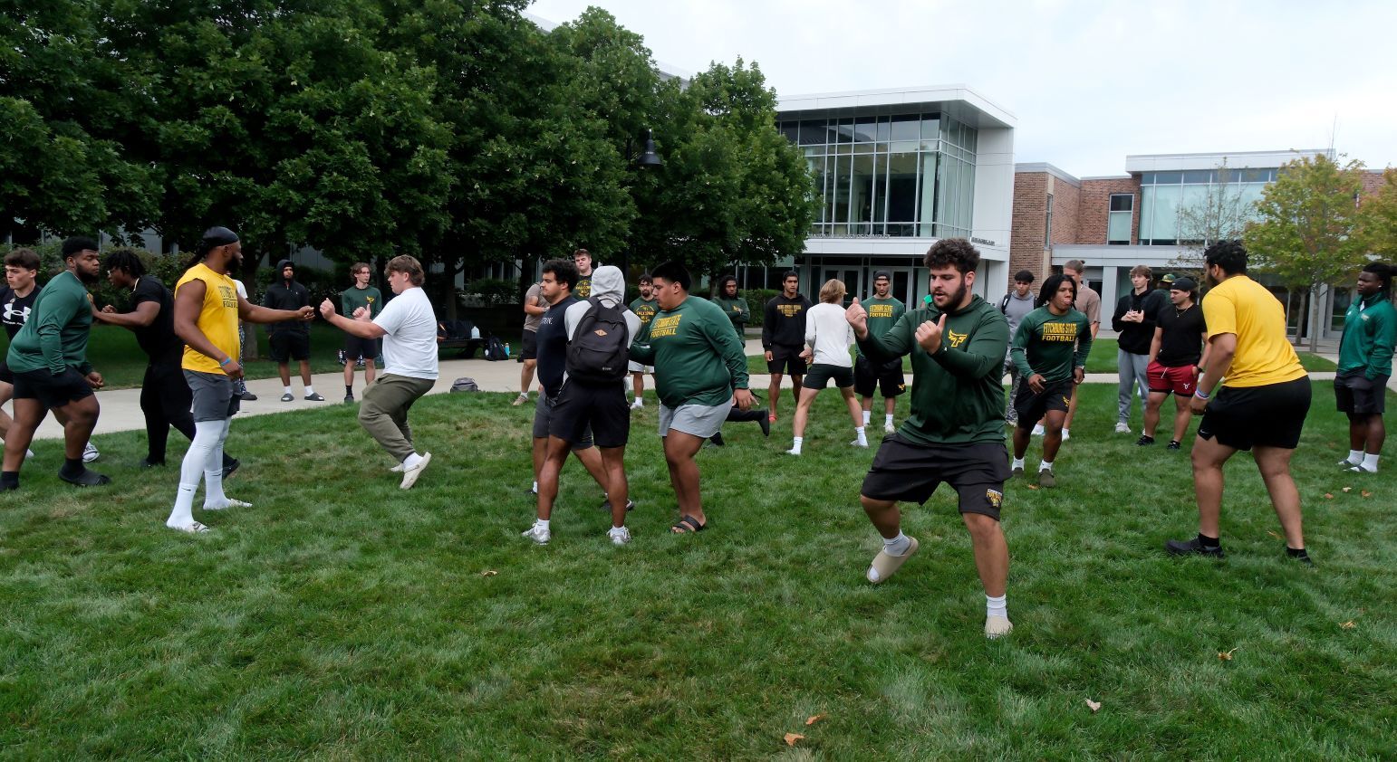 Around Campus - Football Team Run Plays on Quad